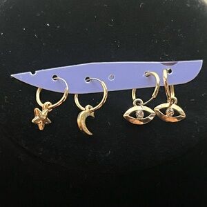 2 Pairs of gold toned bracelets hoop dangle earrings eye  star and moon